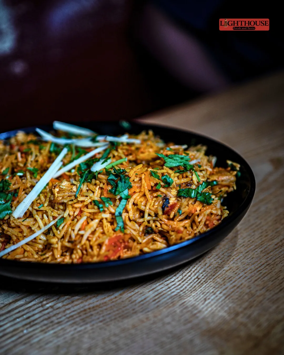 Biryani garnished with fresh coriander